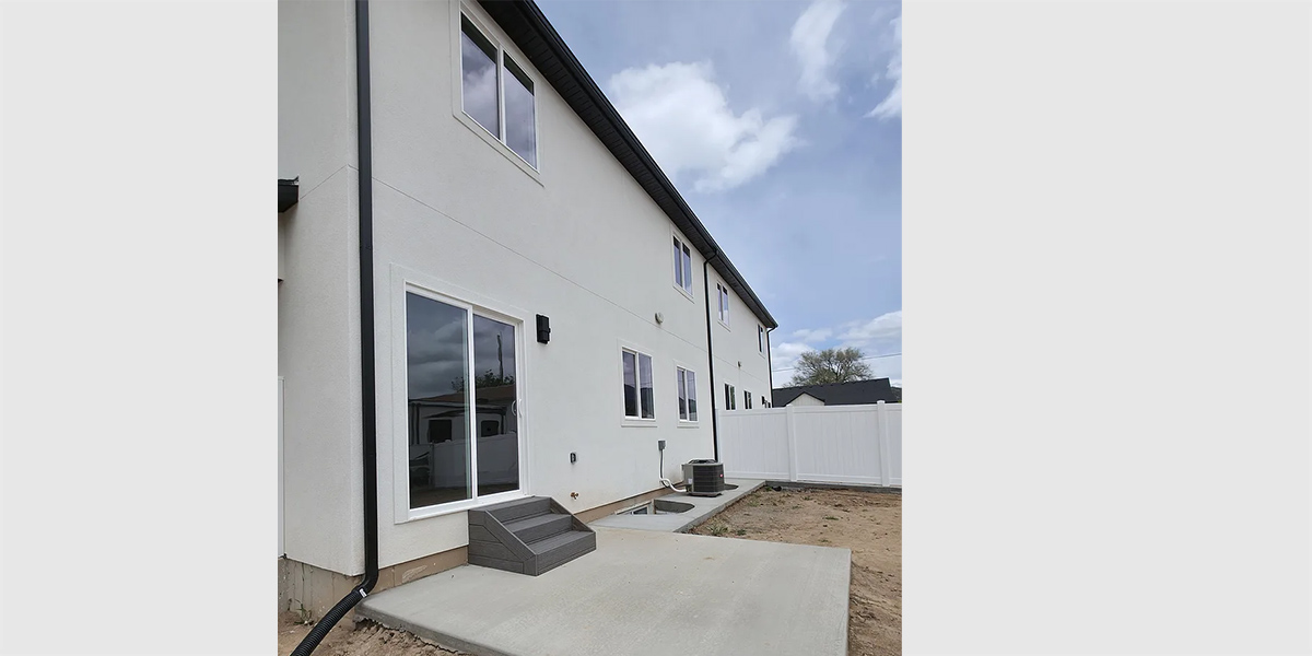 House rear elevation view for D-723 Basement duplex house plan with two car garage D-723